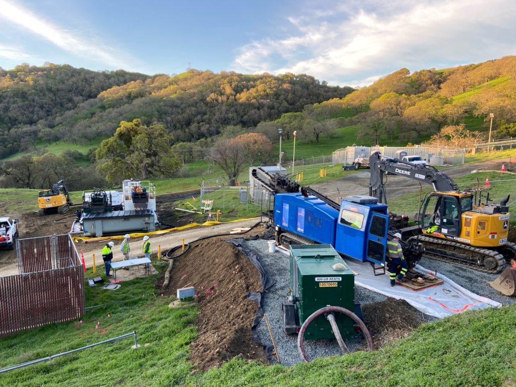 Horizontal wells installed from a drill pad perched on a steep hillside 
